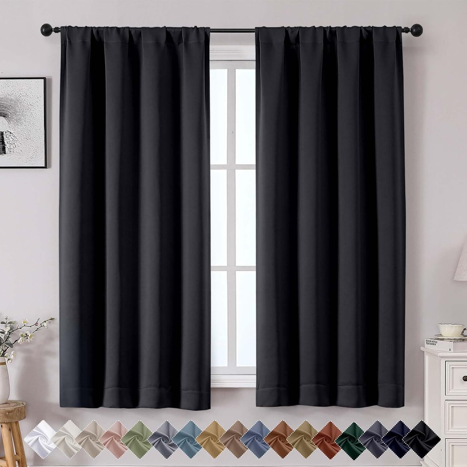 Two black curtain panels with a non-interactive printed color-swatch strip